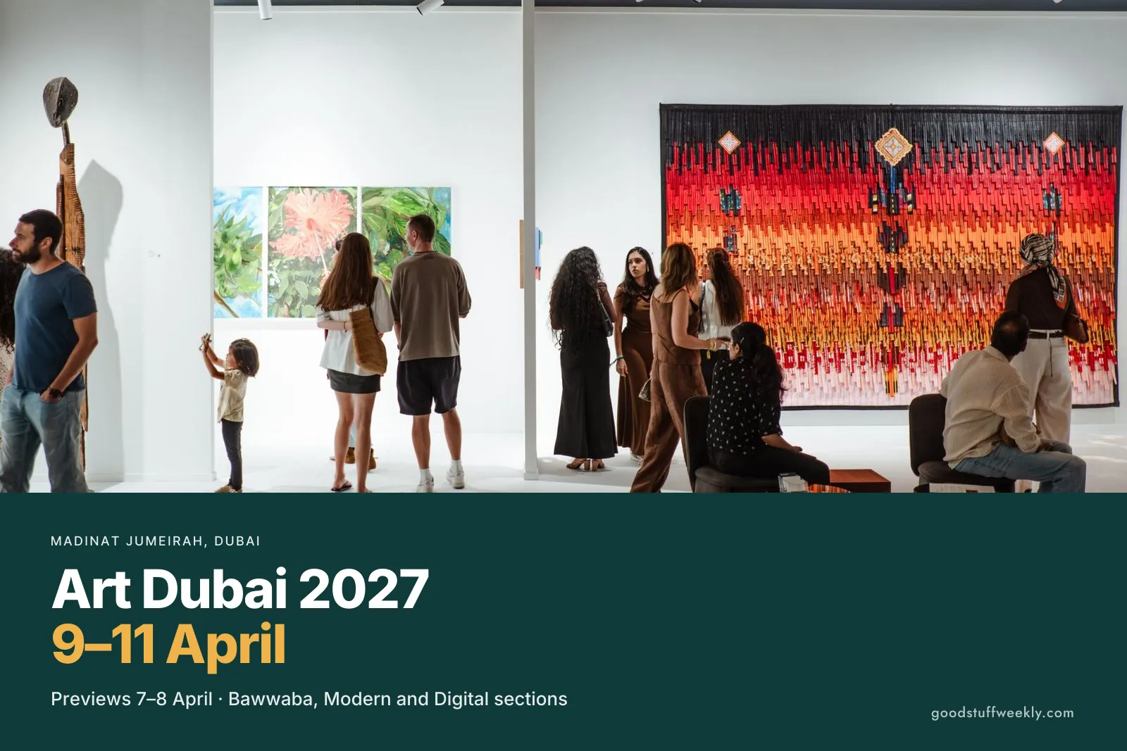 Visitors looking at paintings and a large textile work in a gallery booth at Art Dubai