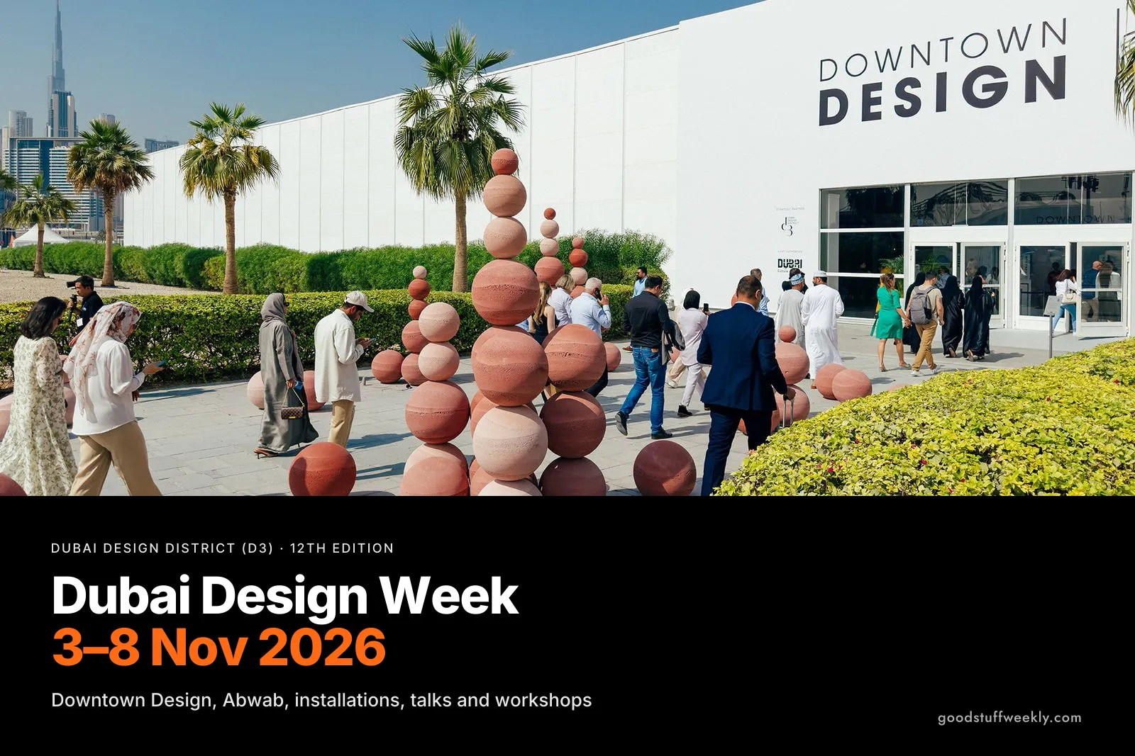 Visitors walking past a sculpture of stacked spheres to the Downtown Design entrance at Dubai Design District