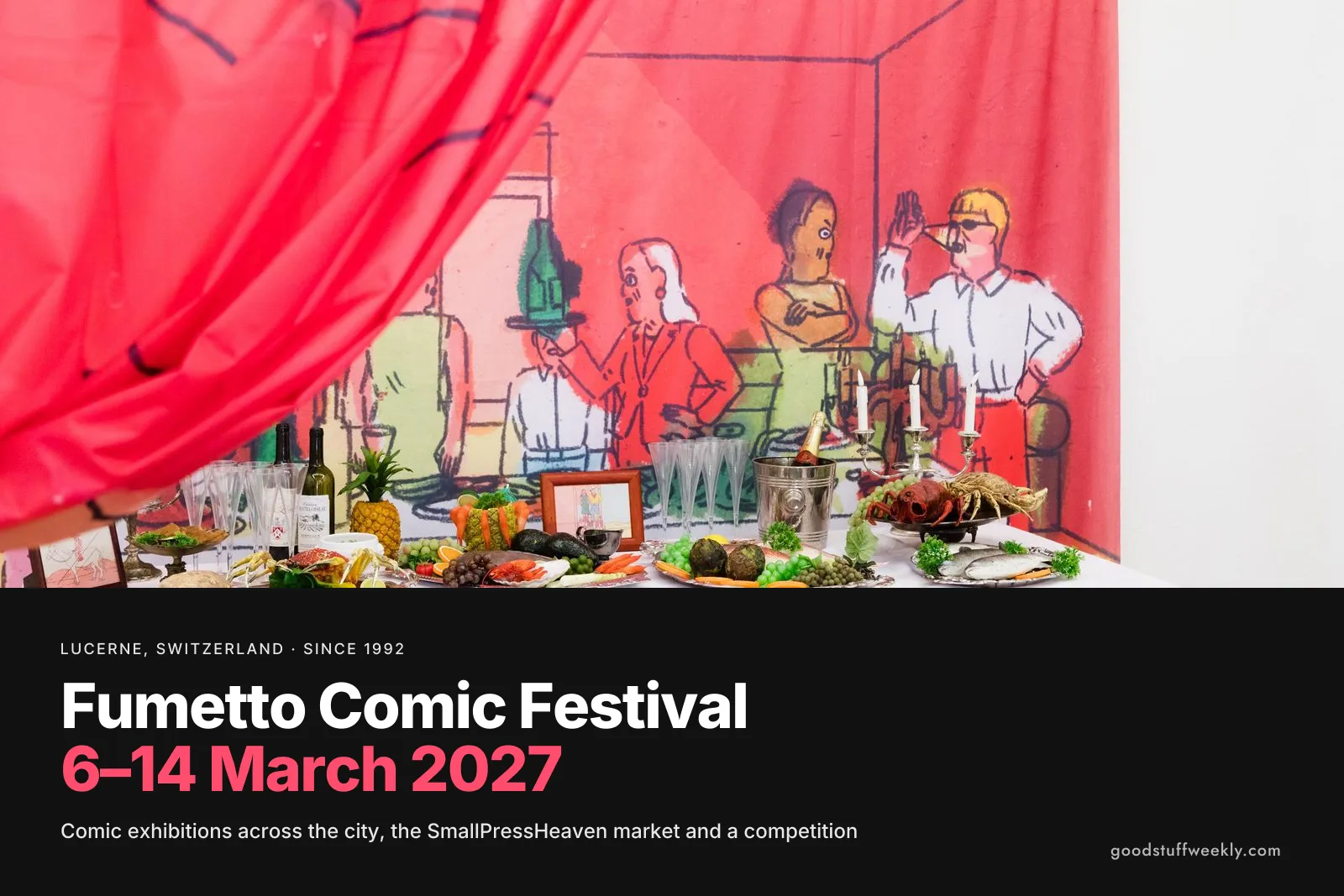 A comic-strip installation with a red curtain and a laden table at Fumetto Comic Festival in Lucerne