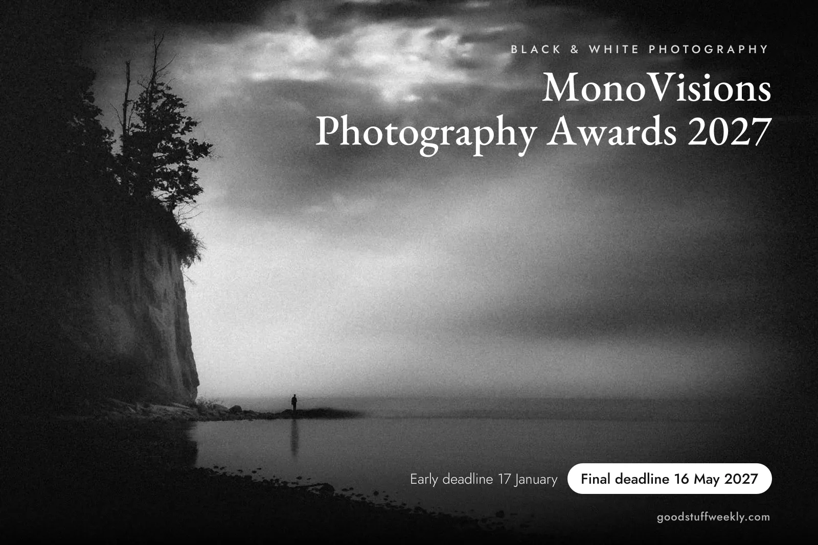 MonoVisions Photography Awards 2027: black and white photo of a lone figure fishing at the foot of a tree-topped cliff under a stormy sky; final deadline 16 May 2027