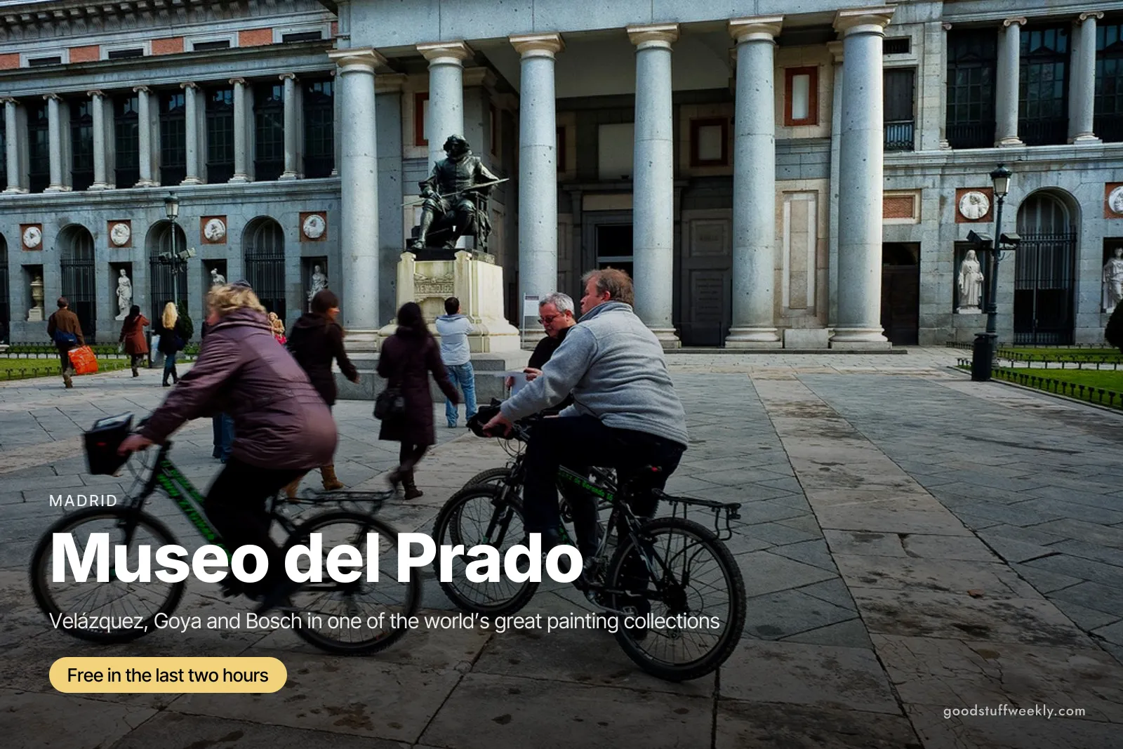 Cyclists passing the Velázquez statue in front of the colonnaded facade of the Museo del Prado in Madrid